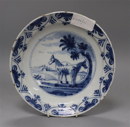An 18th century Delft plate painted with two ponies diameter 23cm